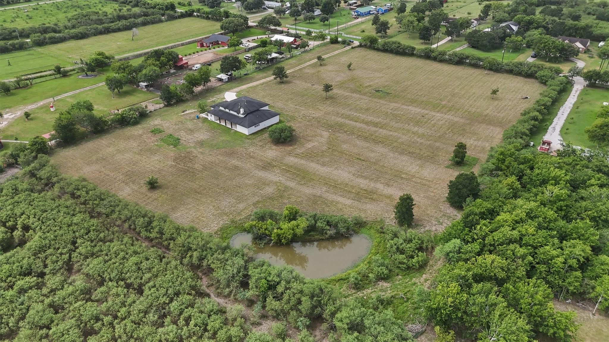 1900 Lezak Road Sealy, TX 77474 - Photo 1 of 34 an aerial view of a house with a yard