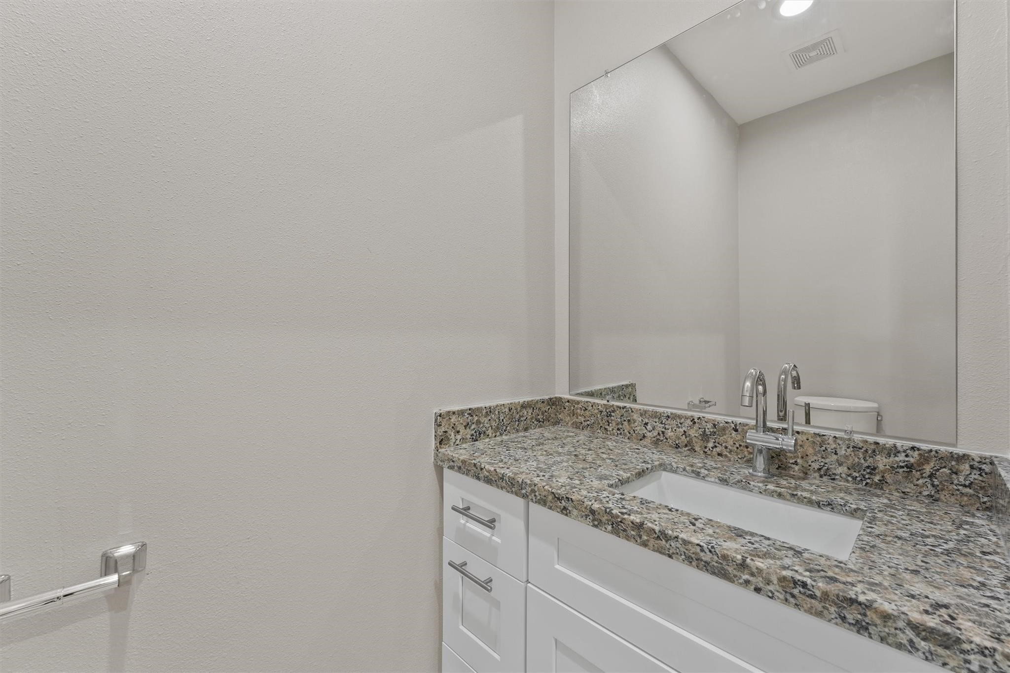 1900 Lezak Road Sealy, TX 77474 - Photo 15 of 34 a bathroom with a granite countertop sink and vanity