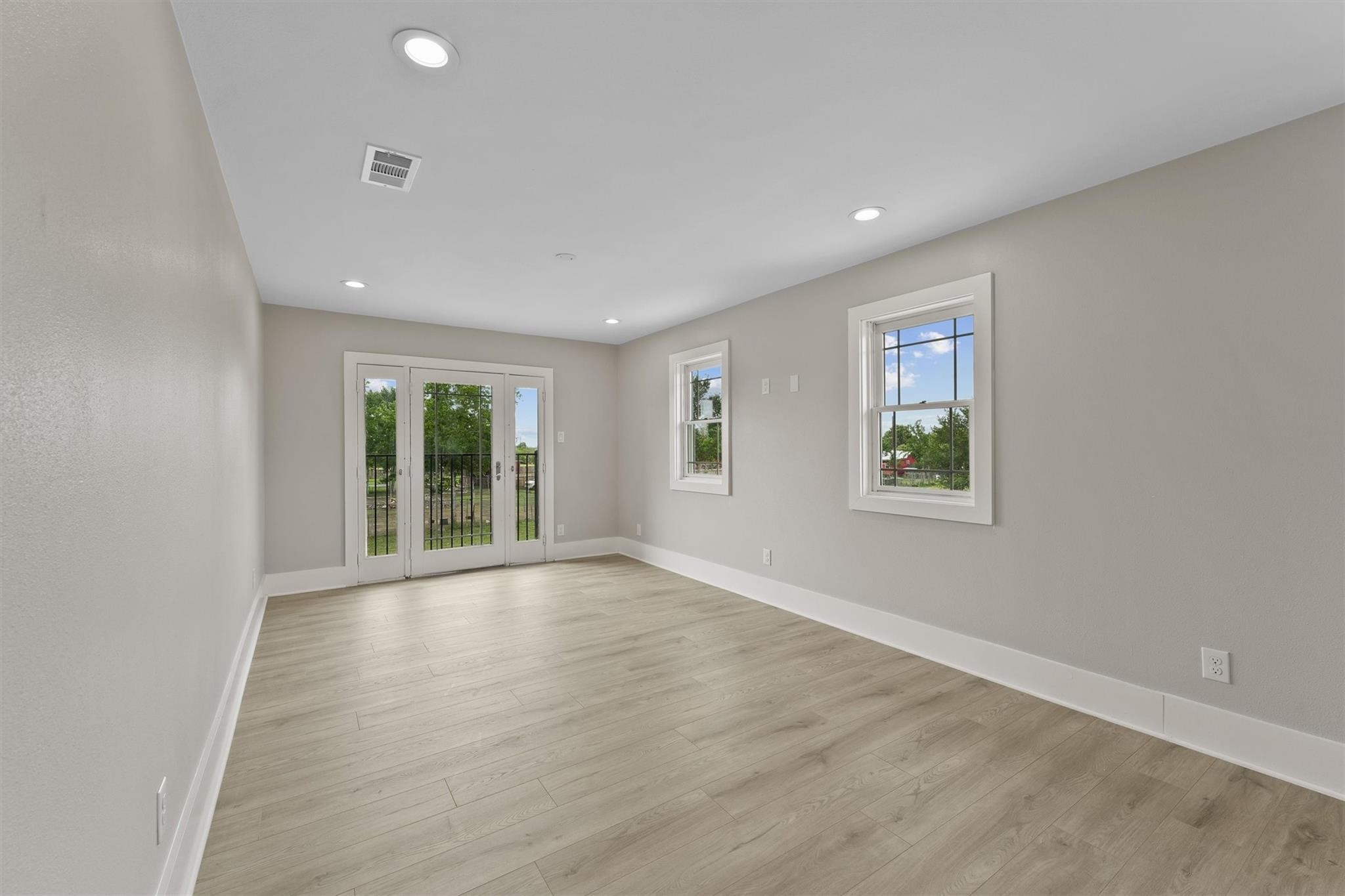 1900 Lezak Road Sealy, TX 77474 - Photo 19 of 34 a view of an empty room with wooden floor and a window