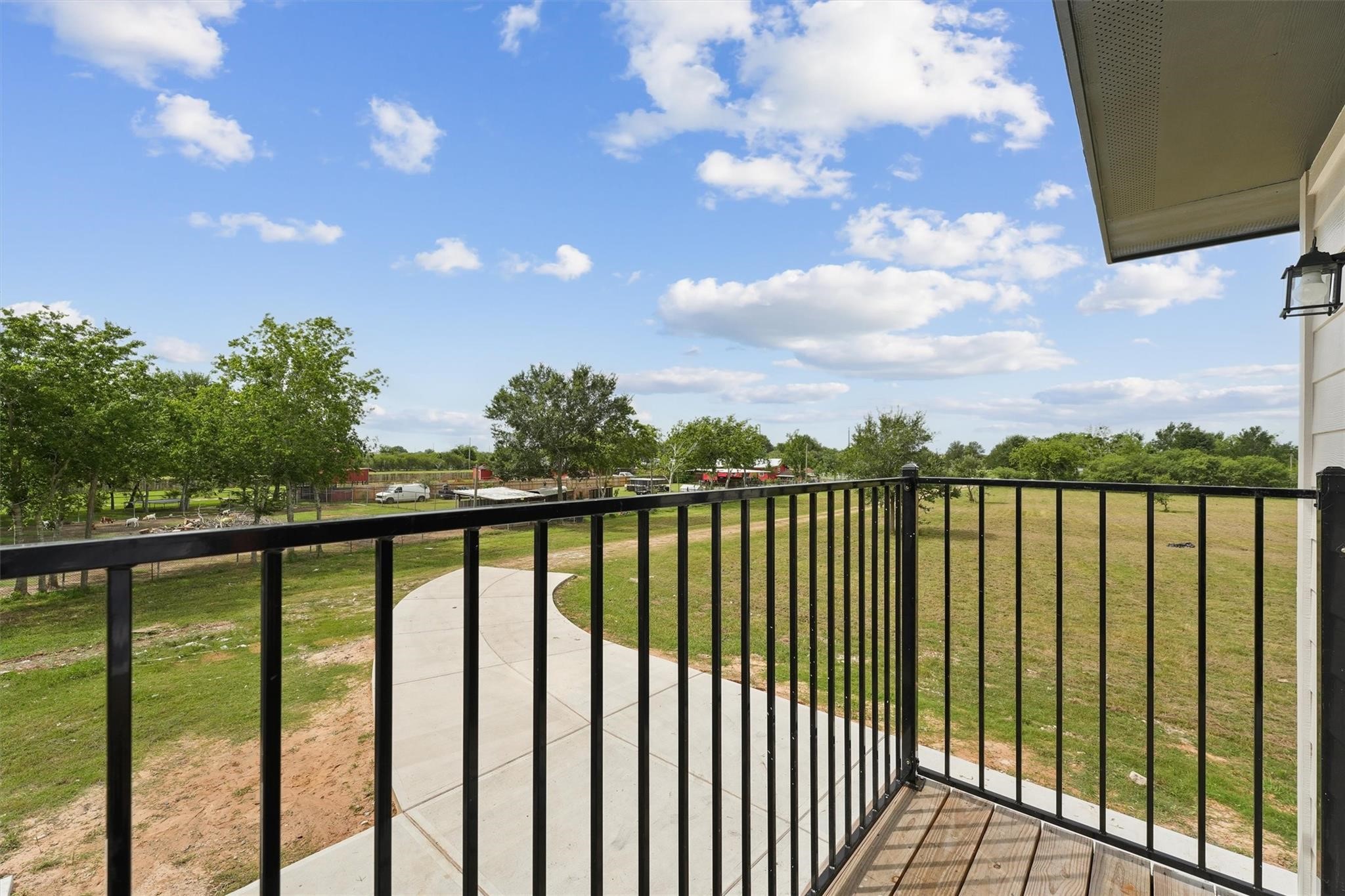 1900 Lezak Road Sealy, TX 77474 - Photo 22 of 34 a view of a balcony with a lake