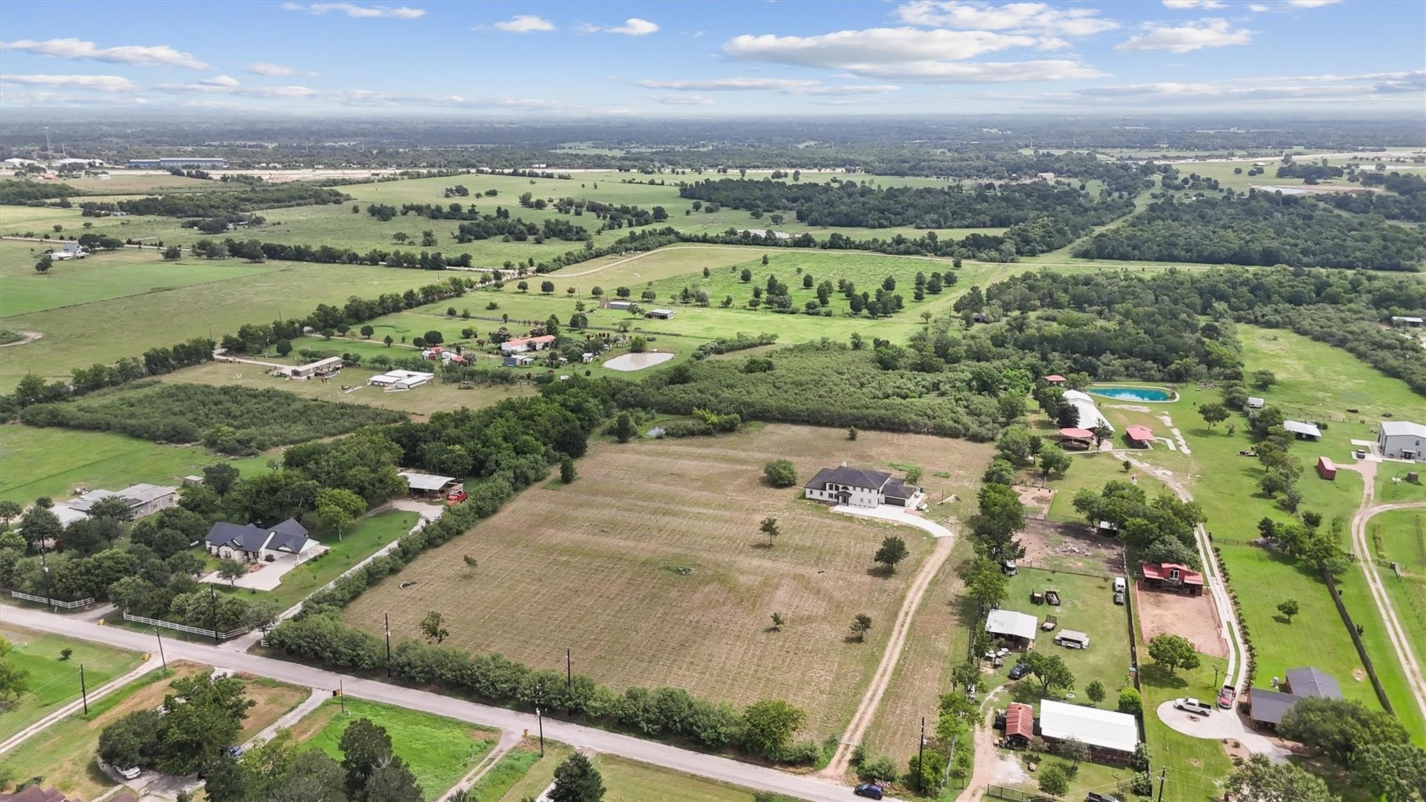 1900 Lezak Road Sealy, TX 77474 - Photo 27 of 34 an aerial view of residential houses with outdoor space