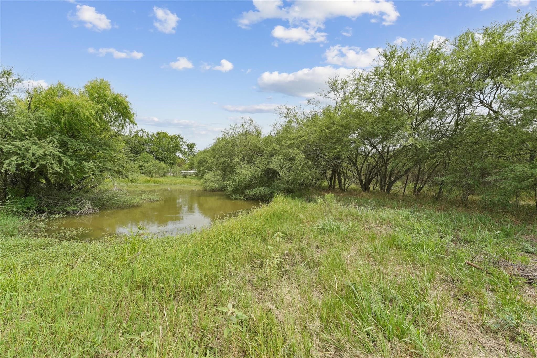 1900 Lezak Road Sealy, TX 77474 - Photo 30 of 34 a view of lake with outdoor space