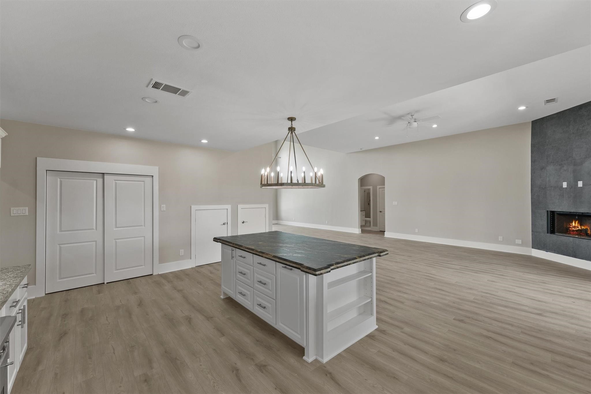 1900 Lezak Road Sealy, TX 77474 - Photo 9 of 34 a kitchen with stainless steel appliances granite countertop a sink a stove and a wooden floors
