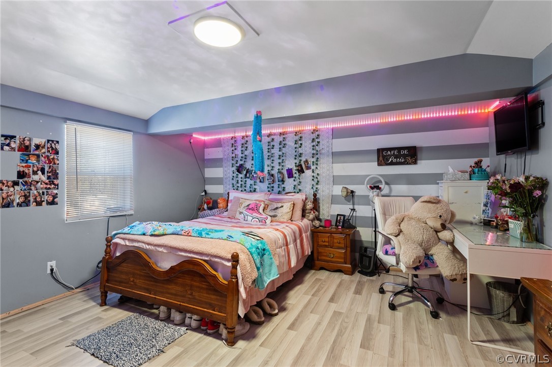 14812 Nash Road Chesterfield, VA 23838 - Photo 13 of 26 a bedroom with a bed and wooden floor