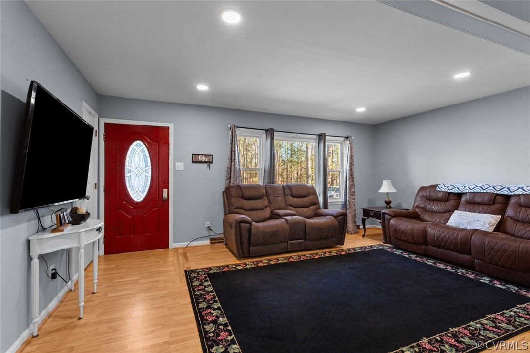 14812 Nash Road Chesterfield, VA 23838 - Photo 6 of 26 a living room with furniture a flat screen tv and a fireplace