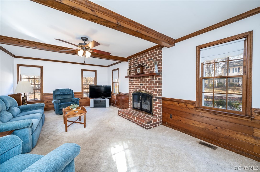 13001 Queensgate Road Midlothian, VA 23114 - Photo 11 of 21 a living room with furniture a fireplace and a large window