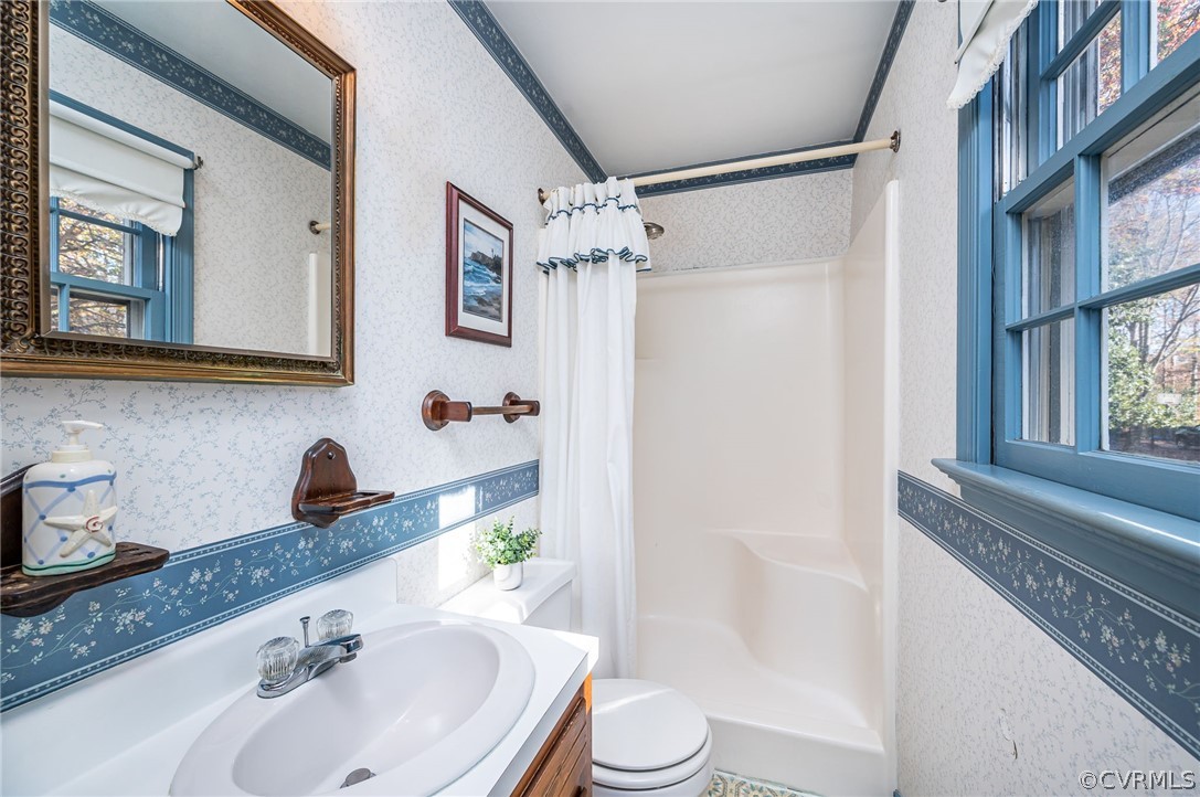 13001 Queensgate Road Midlothian, VA 23114 - Photo 17 of 21 a bathroom with a sink a toilet and shower