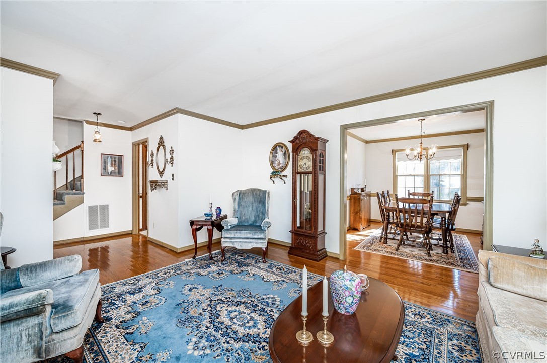 13001 Queensgate Road Midlothian, VA 23114 - Photo 5 of 21 a living room with furniture large window and wooden floor