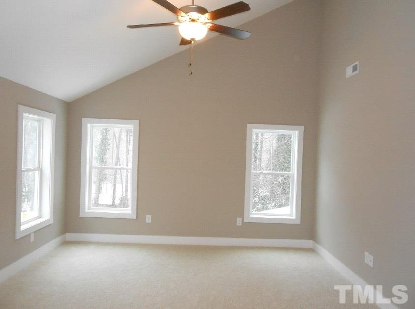181 Pineland Circle Raleigh, NC 27606 - Photo 8 of 13 a view of an empty room with a window
