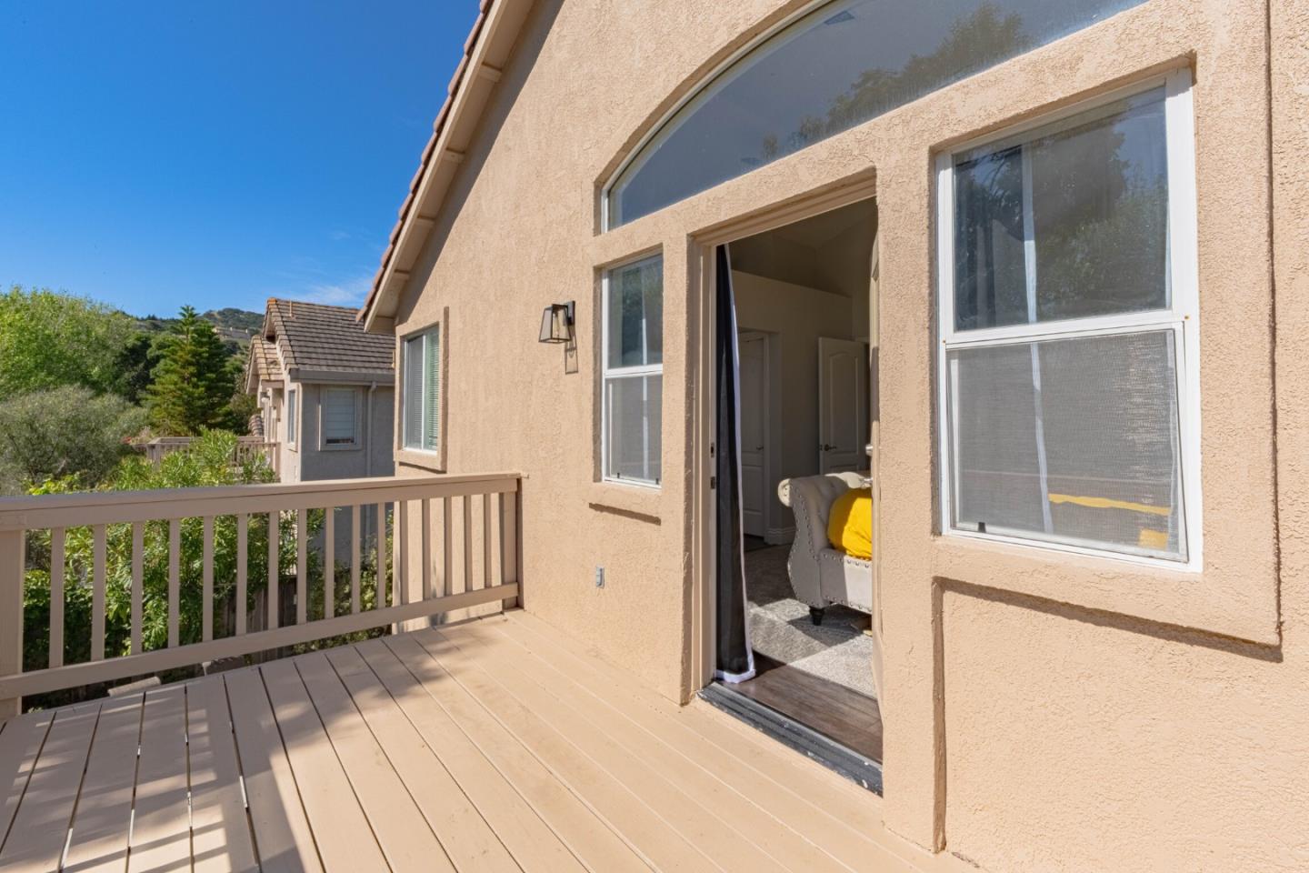 25215 Azalea Court Salinas, CA 93908 - Photo 26 of 48 a view of a balcony with chair and the floor to ceiling window