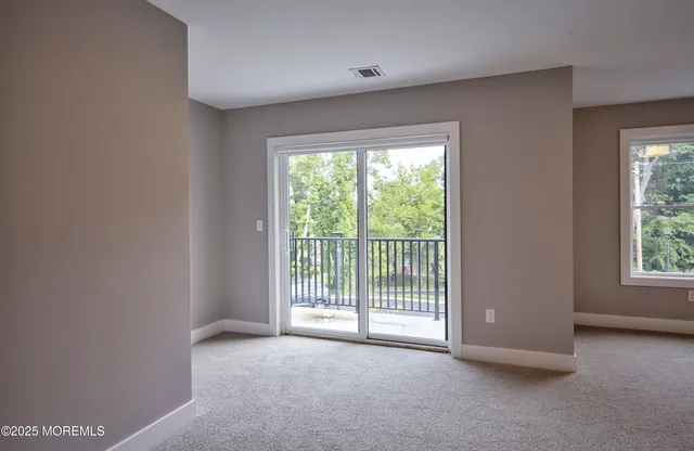 a view of a room with large windows