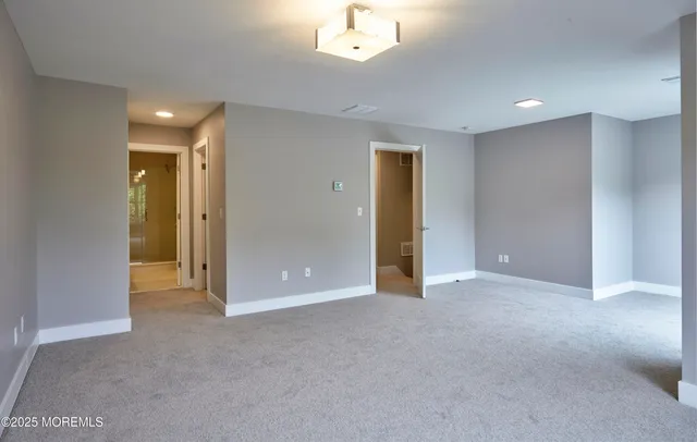 a view of an empty room with a bathroom
