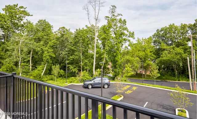 a view of a two chair and table in the balcony