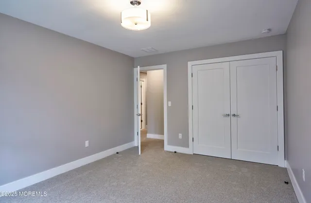 a view of an empty room and a window