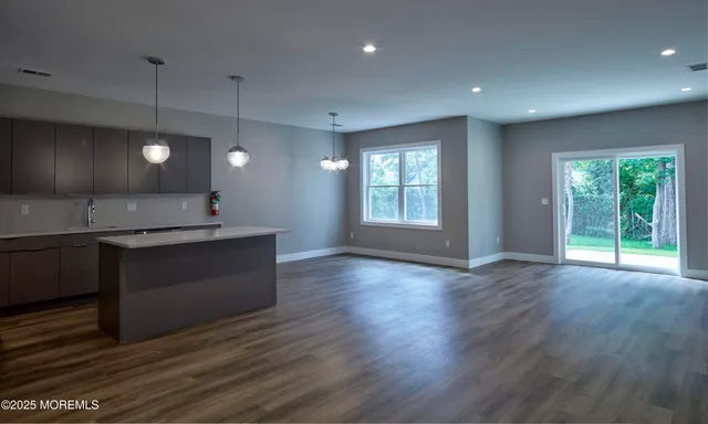 a view of a kitchen with a sink and a window