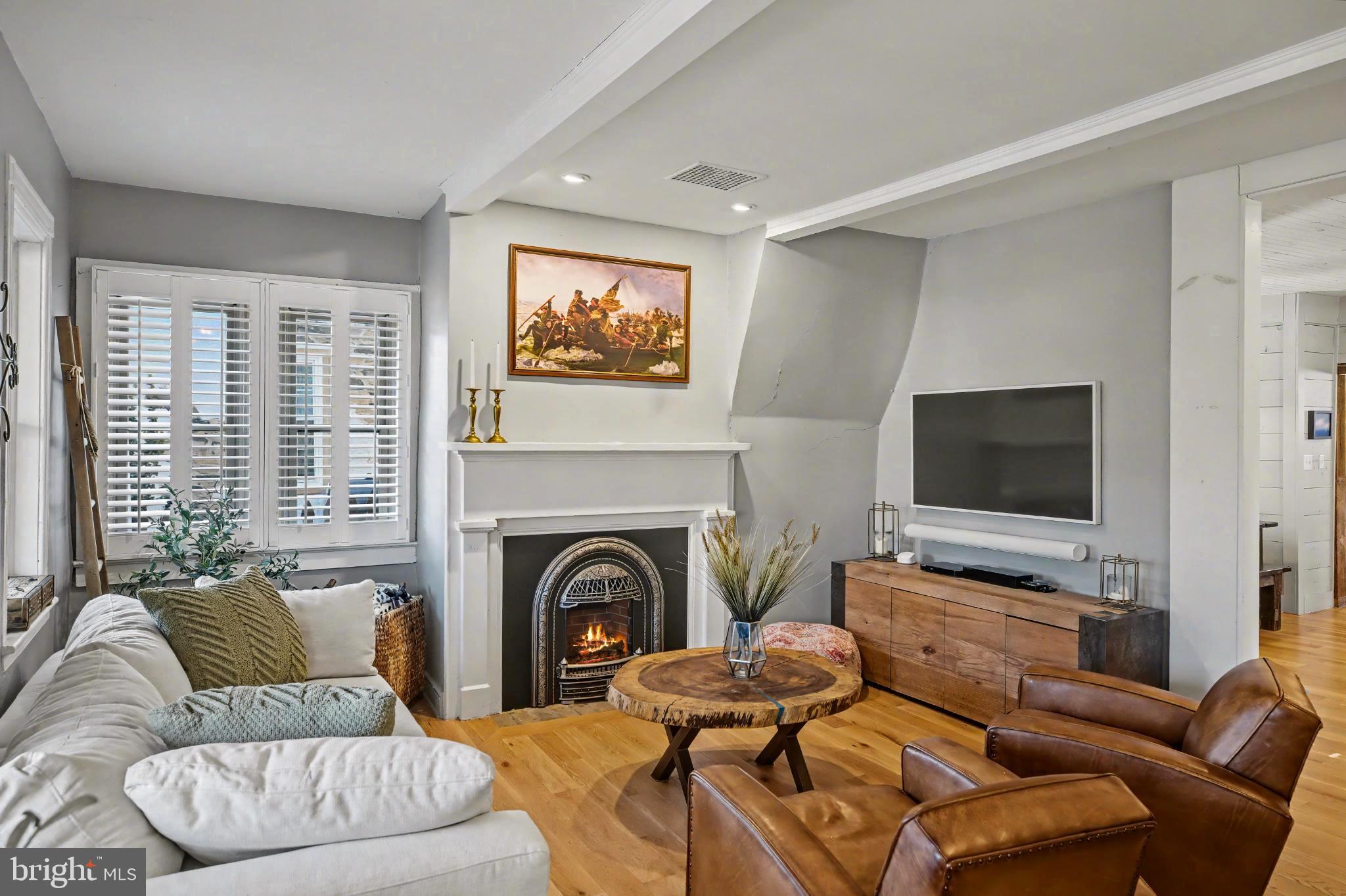 4934 River Road New Hope, PA 18938 - Photo 2 of 56 a living room with furniture and a flat screen tv