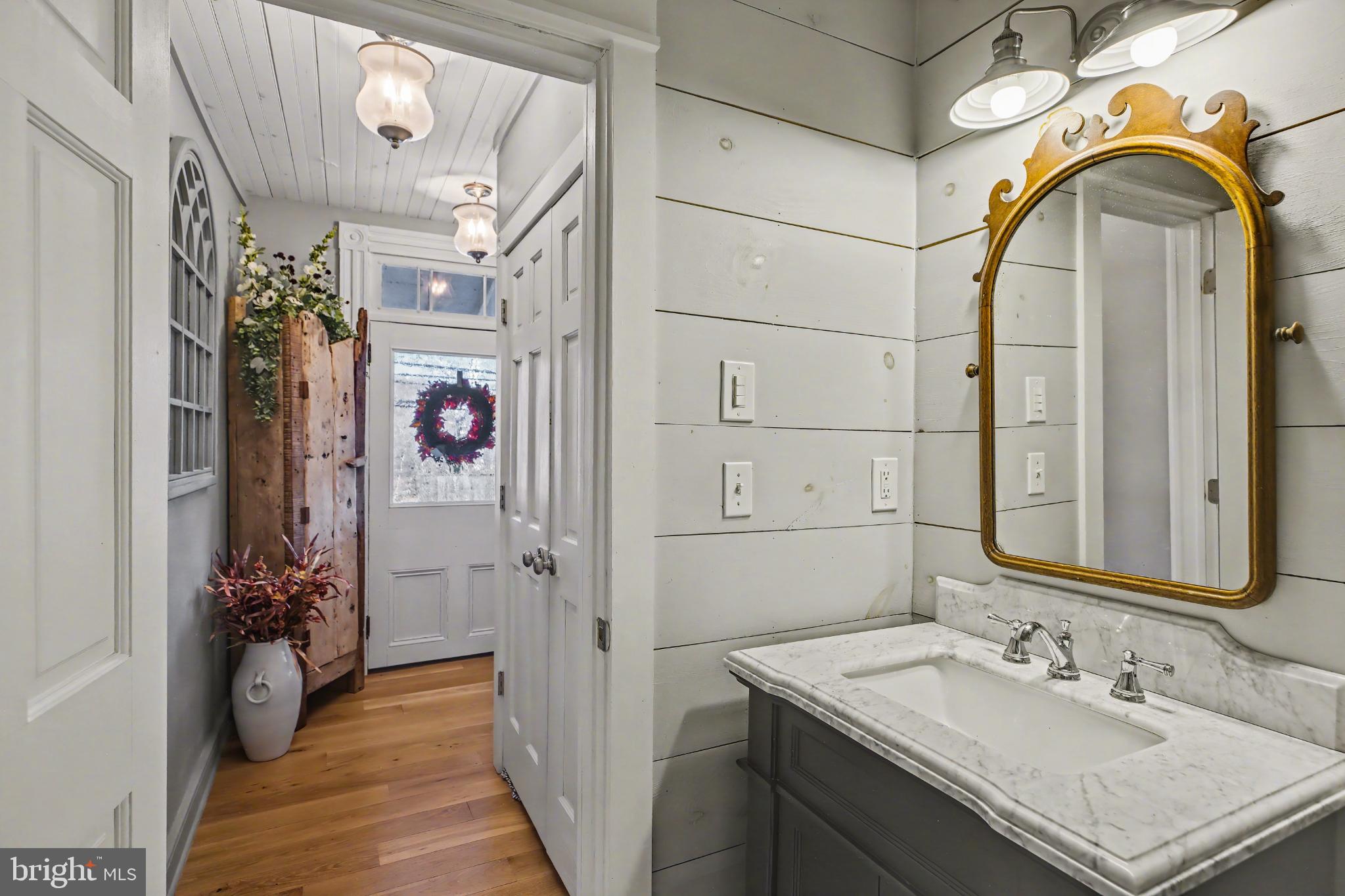 4934 River Road New Hope, PA 18938 - Photo 5 of 56 a bathroom with a sink vanity and a mirror