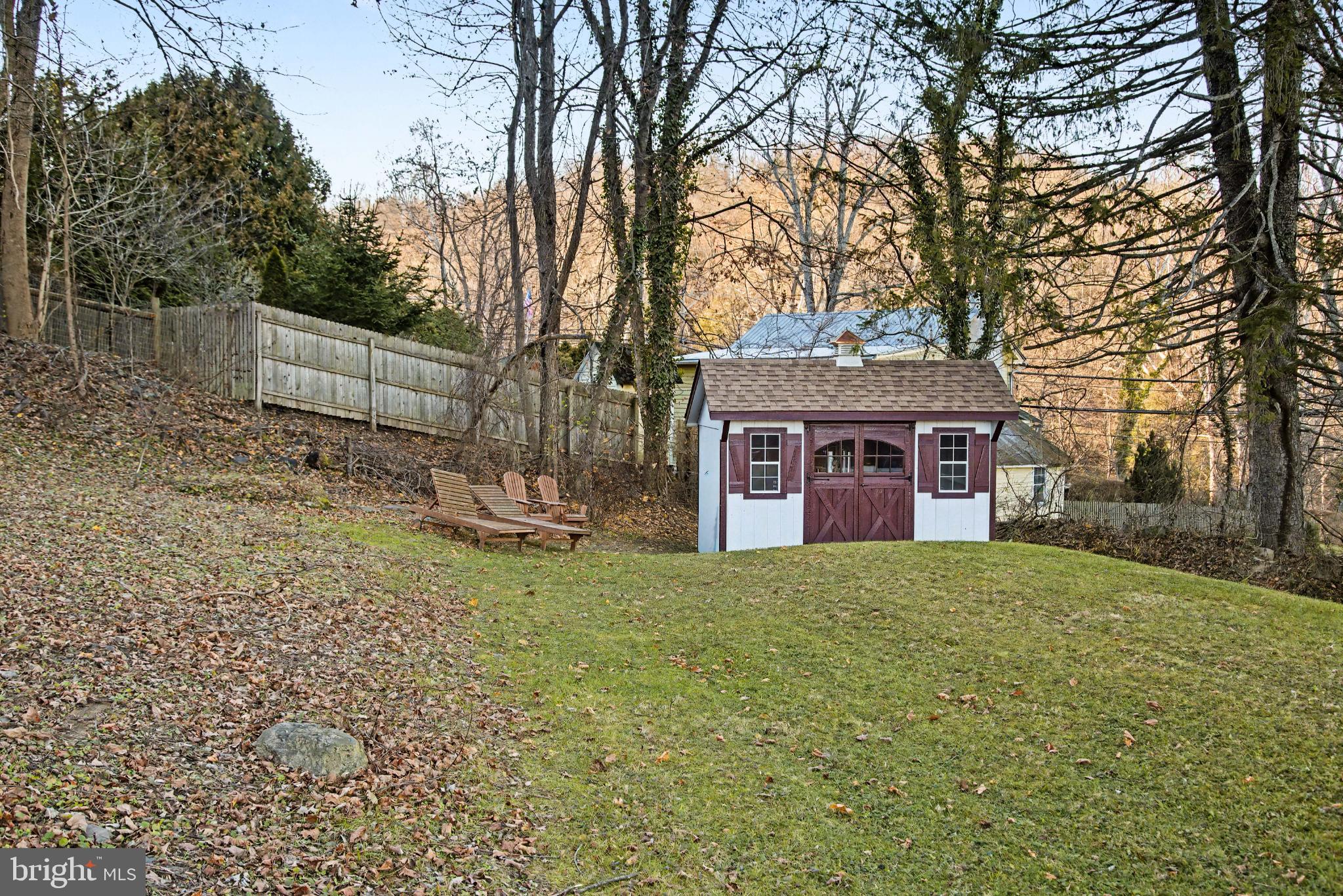 4934 River Road New Hope, PA 18938 - Photo 54 of 56 a front view of a house with a yard