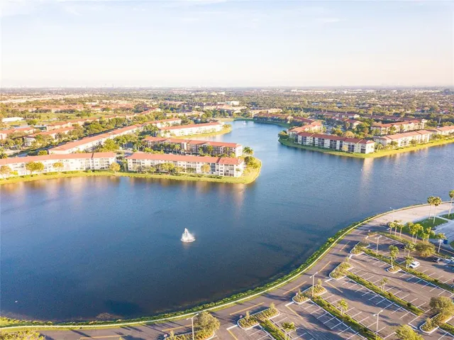an aerial view of a houses with ocean view
