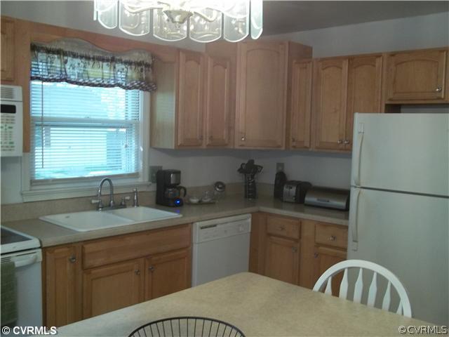 4706 Brookridge Road Chesterfield, VA 23832 - Photo 2 of 9 a kitchen with granite countertop a sink a stove and refrigerator
