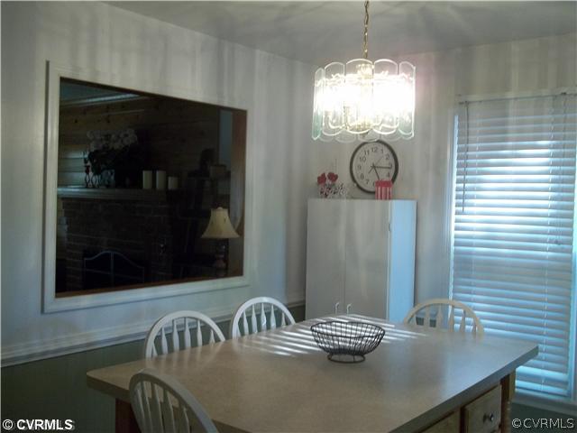 4706 Brookridge Road Chesterfield, VA 23832 - Photo 3 of 9 a view of a dining room with furniture and chandelier