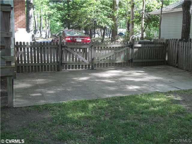 4706 Brookridge Road Chesterfield, VA 23832 - Photo 8 of 9 a view of a backyard with a trees