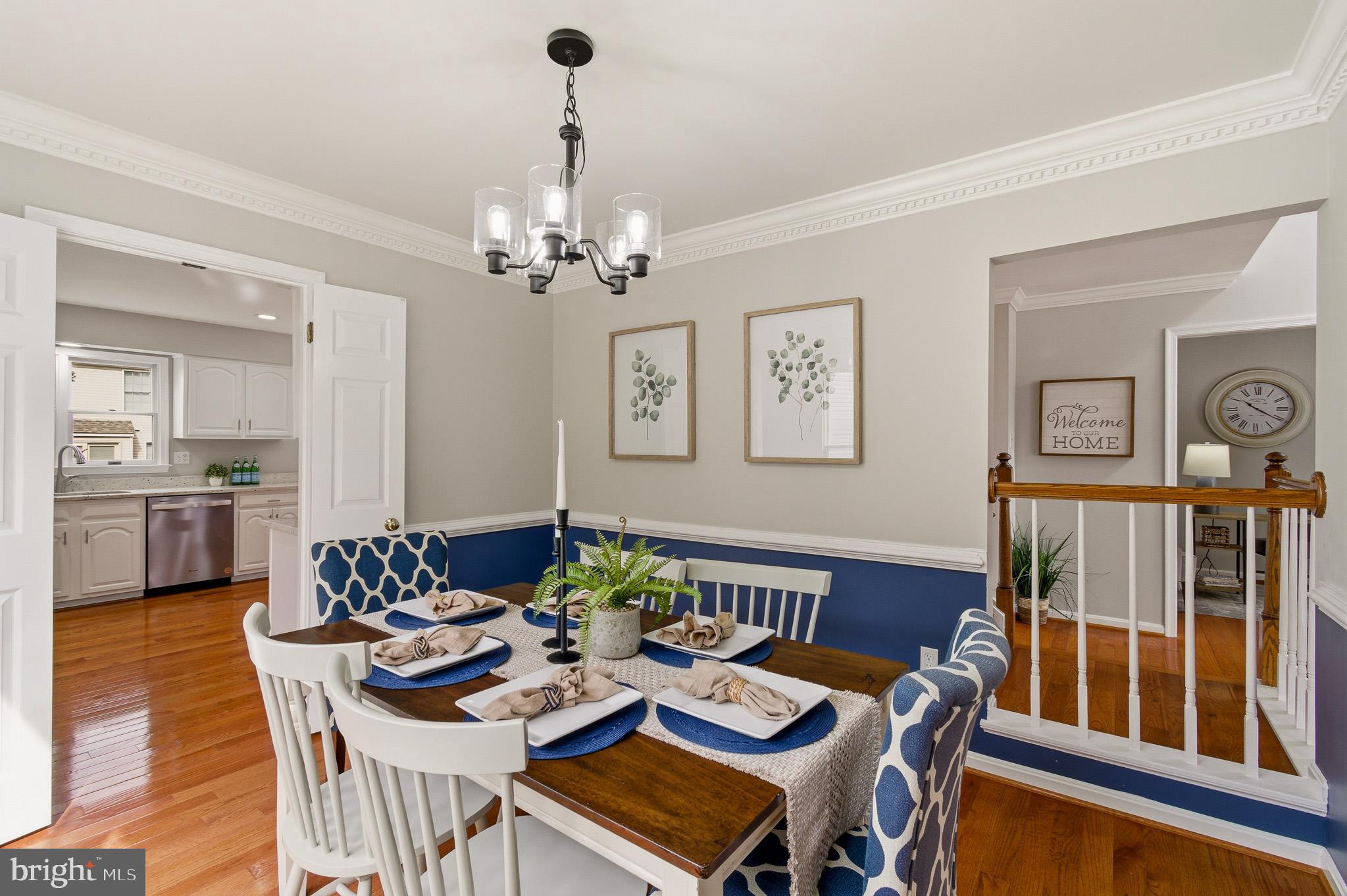 4518 Haywagon Way Ellicott City, MD 21043 - Photo 11 of 54 a view of a dining room with furniture and wooden floor