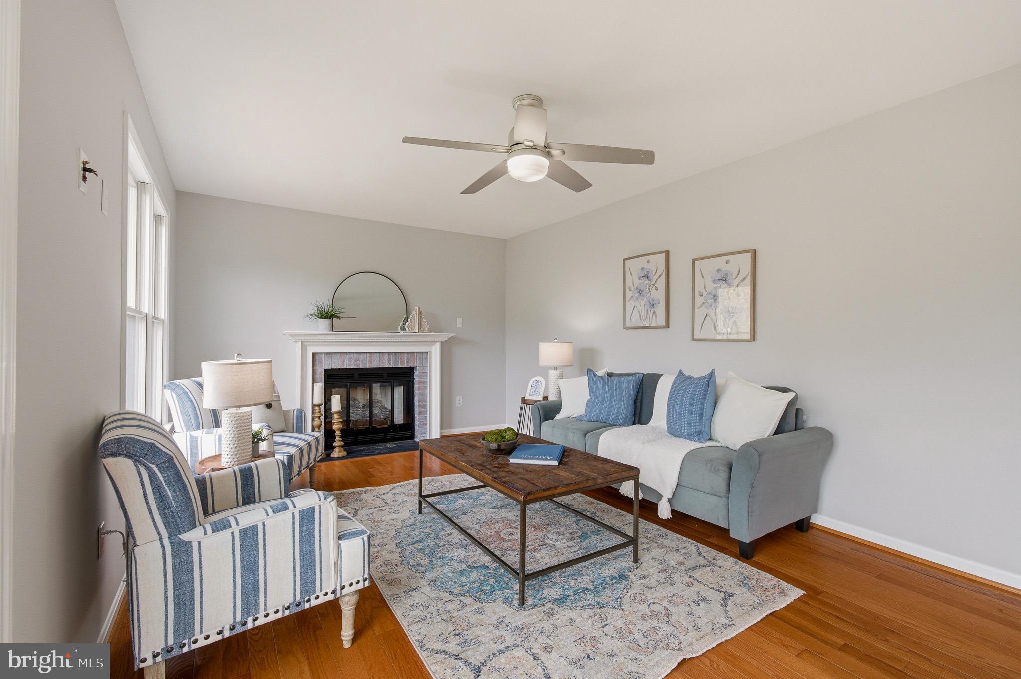 4518 Haywagon Way Ellicott City, MD 21043 - Photo 22 of 54 a living room with furniture and a fireplace
