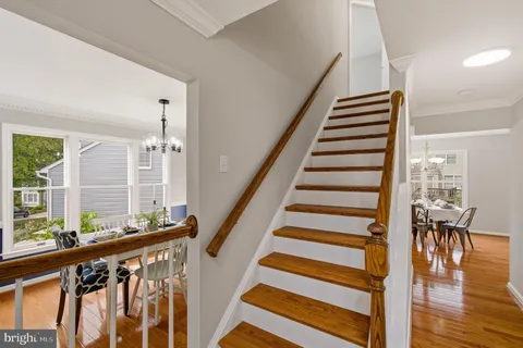 a view of entryway with wooden floor and stairs