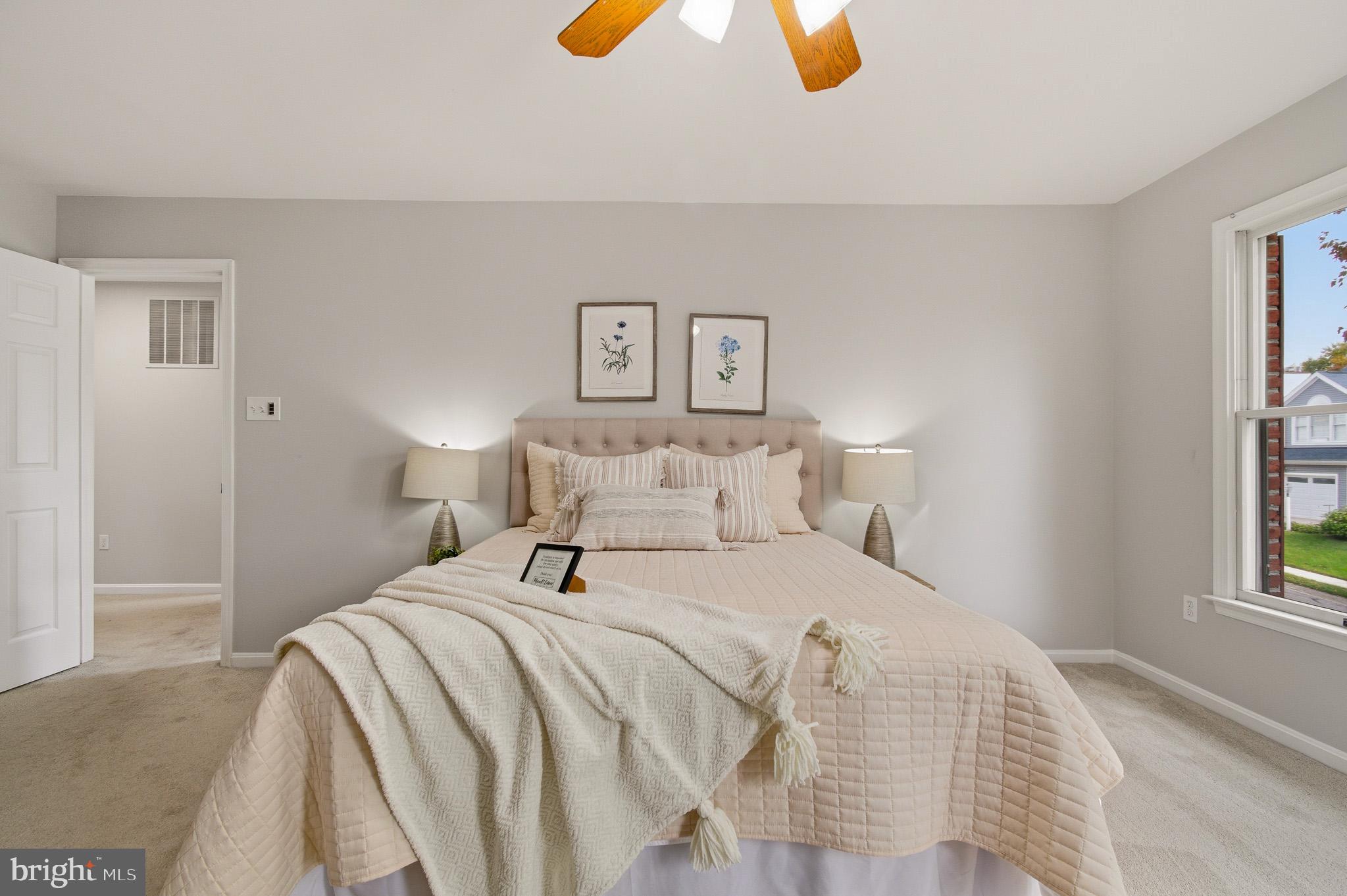 4518 Haywagon Way Ellicott City, MD 21043 - Photo 27 of 54 a bedroom with a bed and painting on the wall