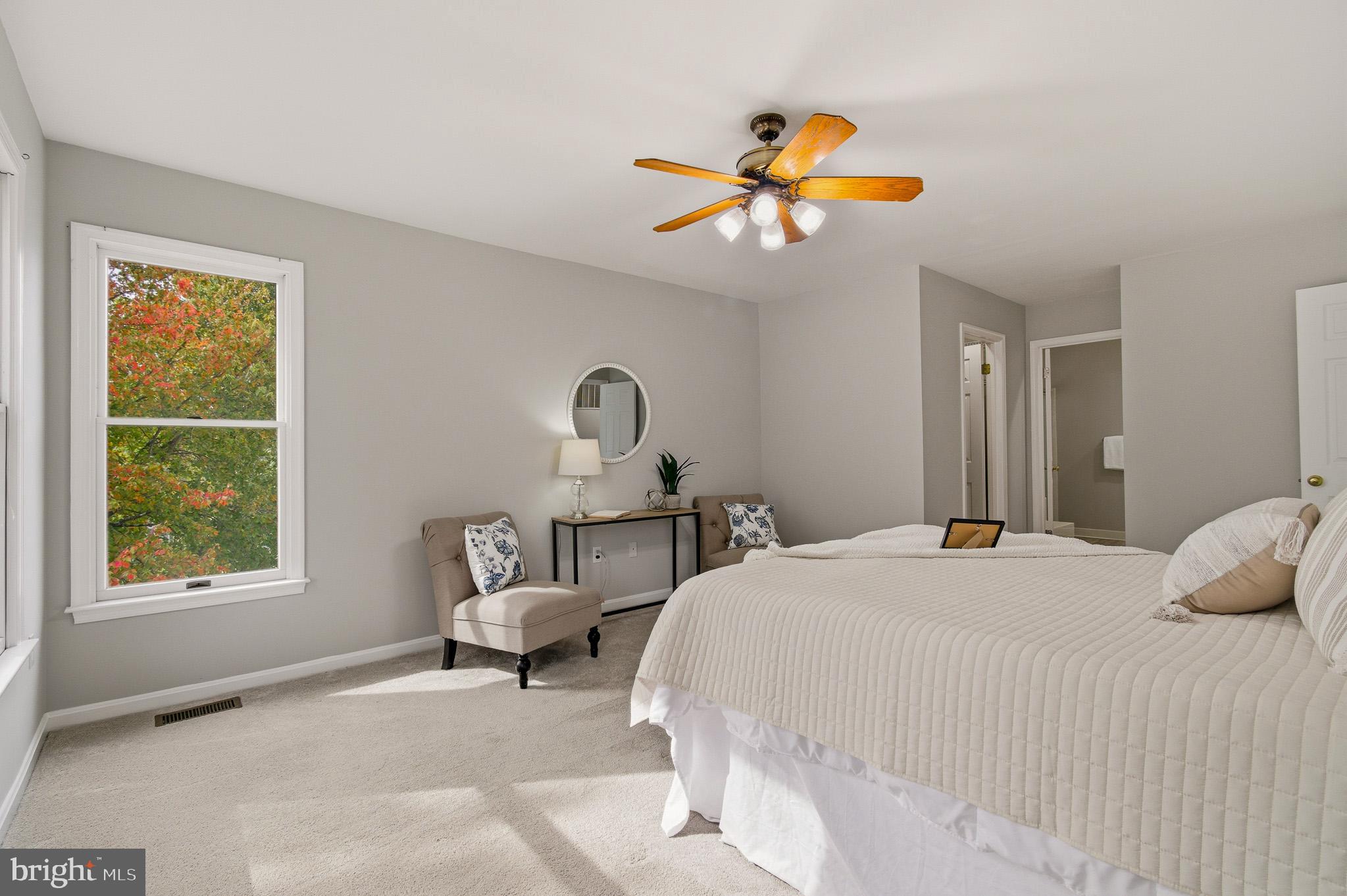 4518 Haywagon Way Ellicott City, MD 21043 - Photo 29 of 54 a bedroom with a bed and a chandelier