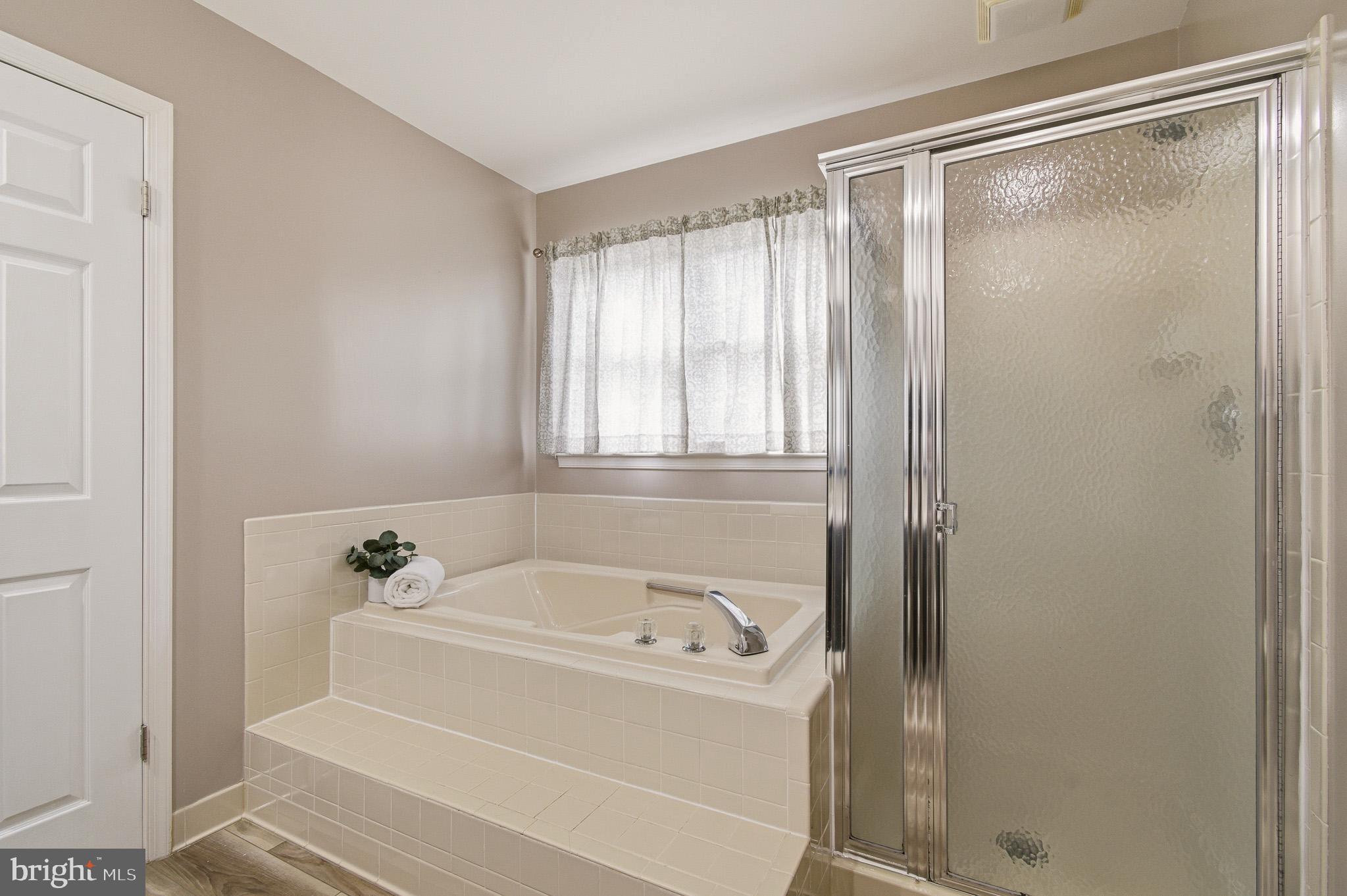 4518 Haywagon Way Ellicott City, MD 21043 - Photo 31 of 54 a white bath tub sitting next to a shower