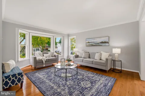 a living room with furniture and a rug