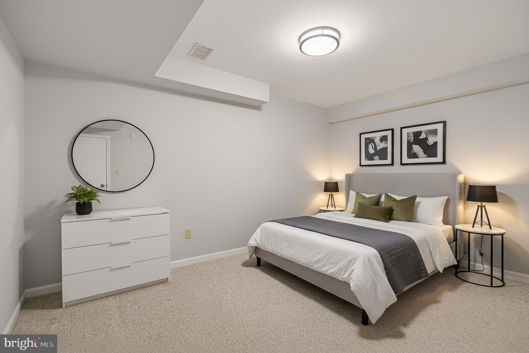 4518 Haywagon Way Ellicott City, MD 21043 - Photo 44 of 54 a bedroom with a bed and a chandelier