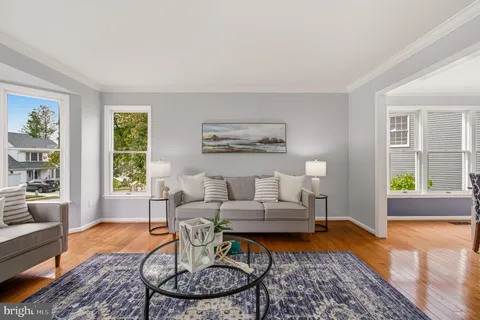 a living room with furniture and a rug