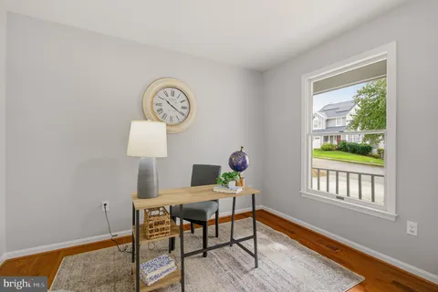 a workspace with furniture and a window