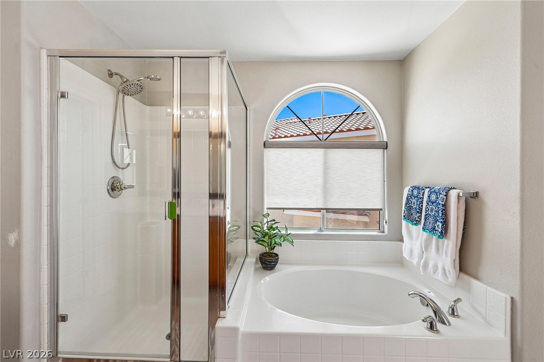 1176 Butternut Ranch Court Henderson, NV 89052 - Photo 36 of 60 Indulge in a tranquil bathing experience with a large soaking tub and separate shower.