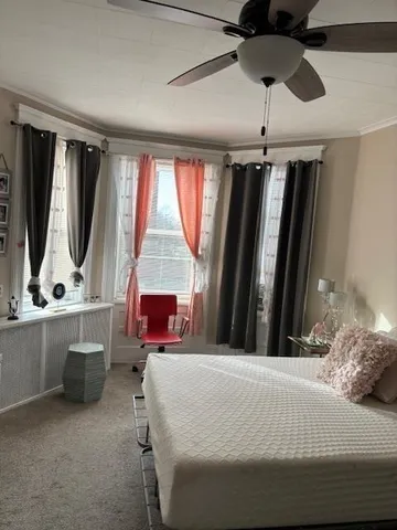 a bed room with a bed and a television