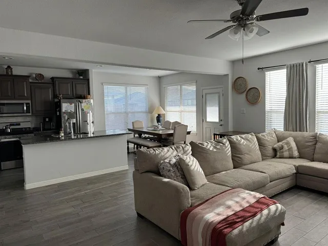 a living room with furniture and a window