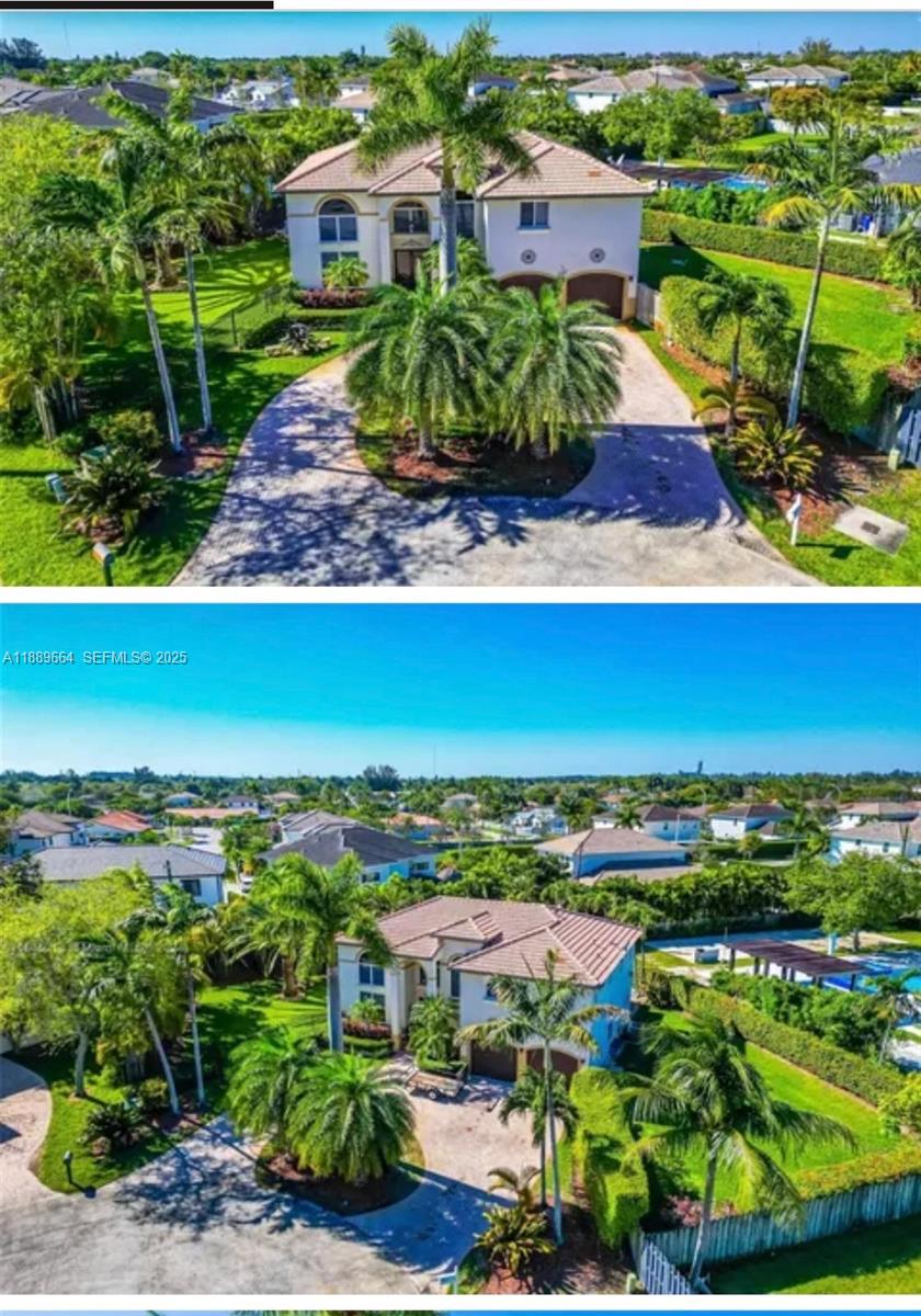 an aerial view of residential houses with outdoor space and trees