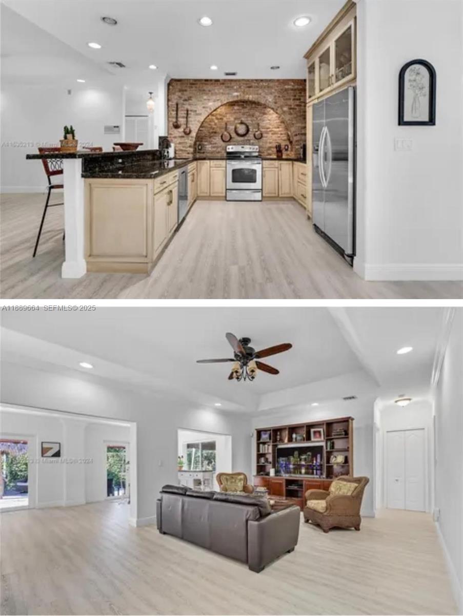 12071 Southwest 1st Street Miami, FL 33184 - Photo 9 of 13 a living room with stainless steel appliances kitchen island granite countertop a sink and a refrigerator