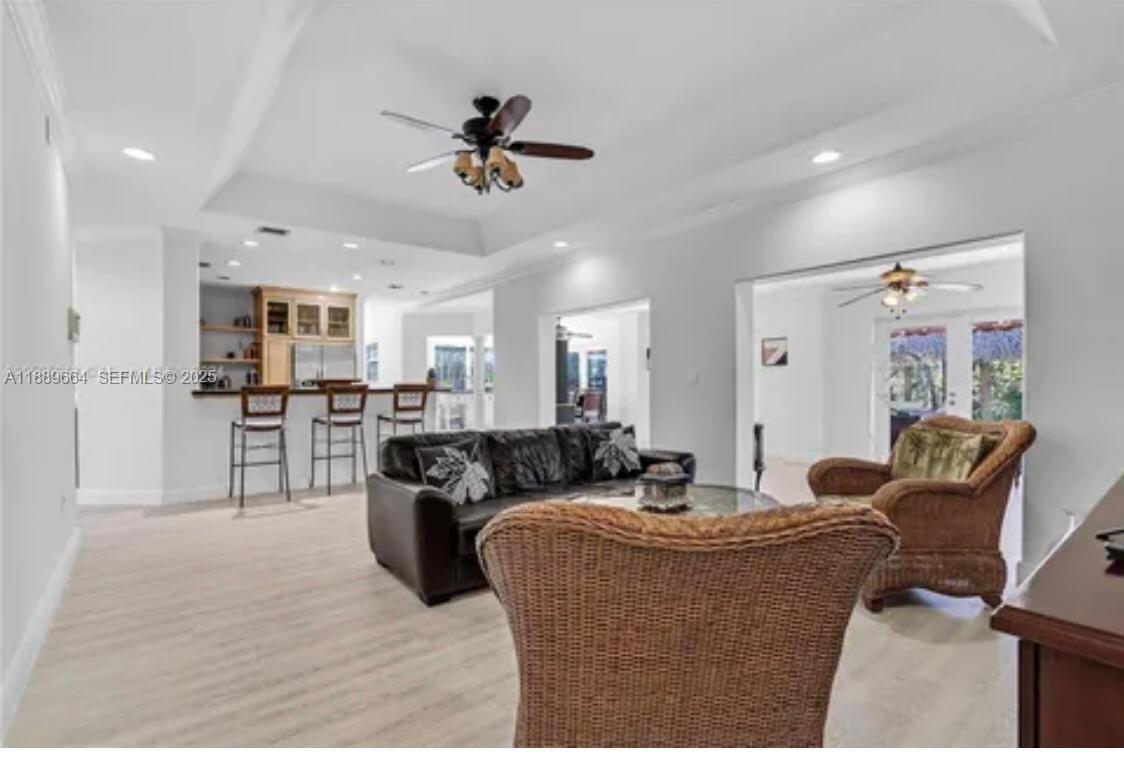 12071 Southwest 1st Street Miami, FL 33184 - Photo 10 of 13 a living room with furniture and kitchen view