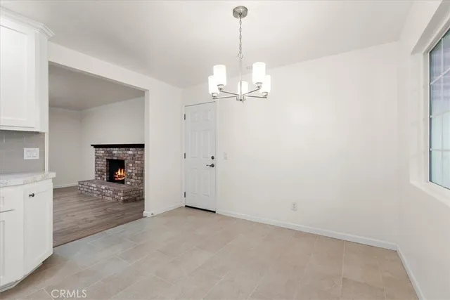 a view of a livingroom and a chandelier fire place