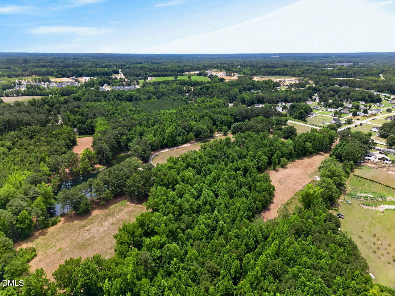 1217 Eagle Rock Road Wendell, NC 27591 - Photo 12 of 17 an aerial view of a city with lots of residential buildings and mountain view in back