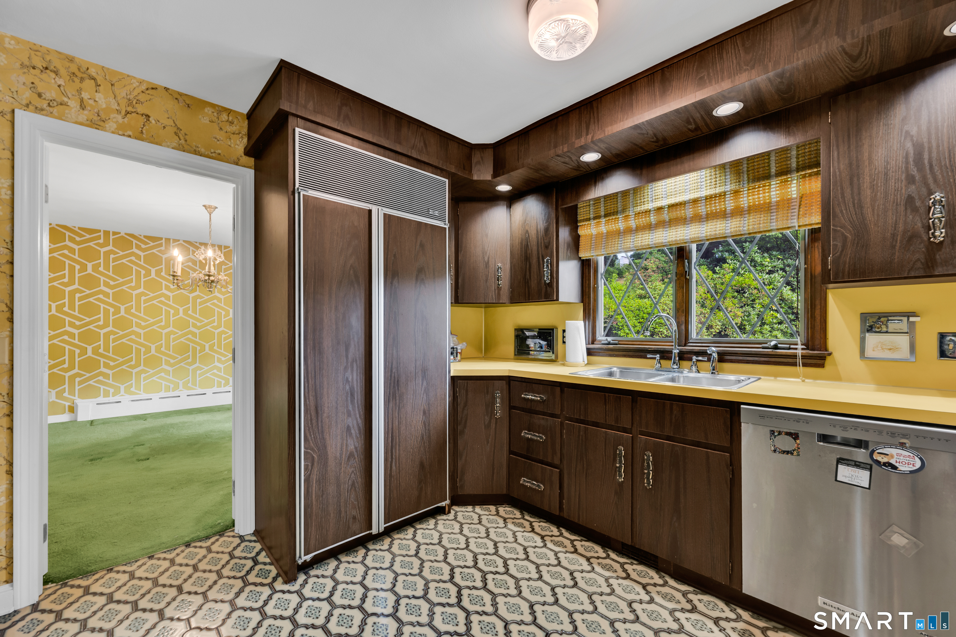 232 Maybrook Road Waterbury, CT 06708 - Photo 13 of 38 a kitchen with a sink window and cabinets