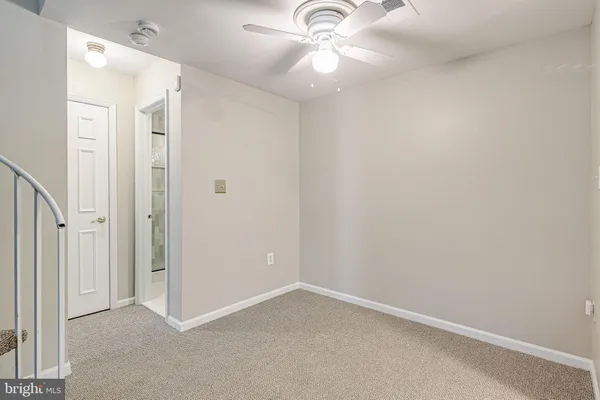 a kitchen with stainless steel appliances a refrigerator and a chandelier