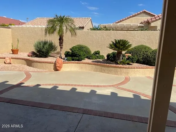 a view of a swimming pool with a yard