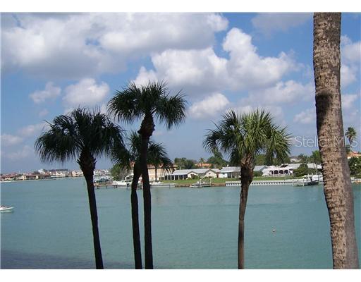 9415 Blind Pass Road, Unit 206 St. Pete Beach, FL 33706 - Photo 1 of 1 Waterfront - Sweeping water views from wrap-around balcony, 30 x 6 , and additional private master suite balcony