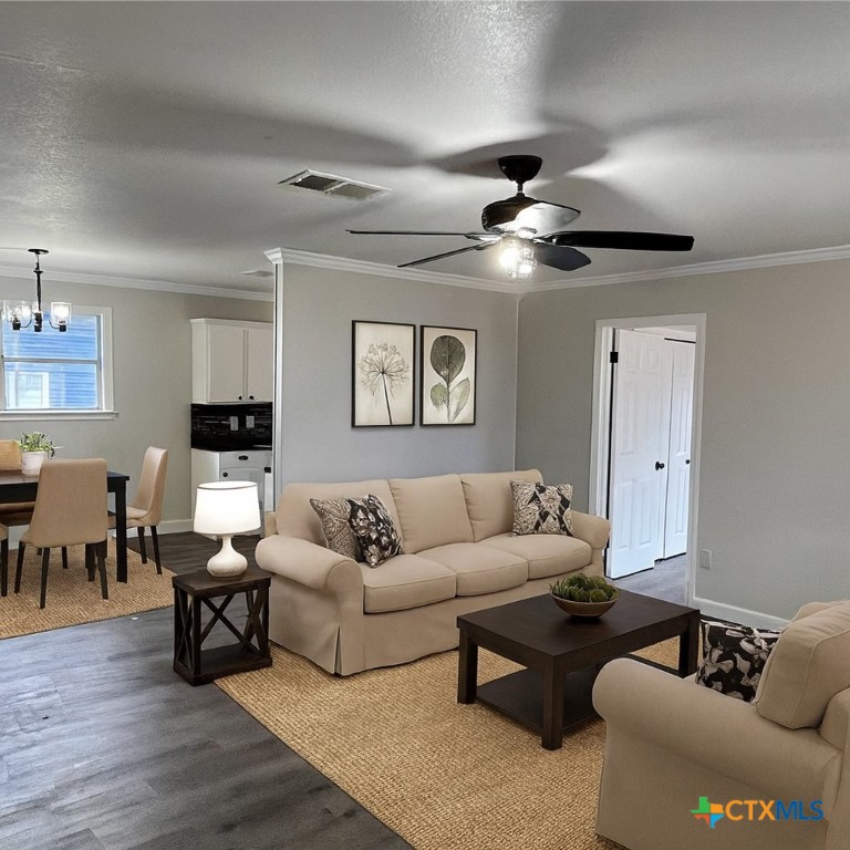 1201 South 21st Street Temple, TX 76504 - Photo 2 of 15 a living room with furniture and wooden floor