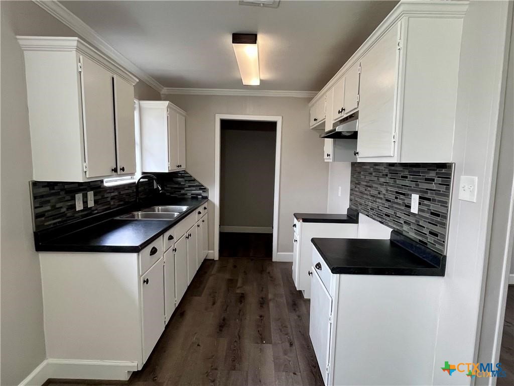 1201 South 21st Street Temple, TX 76504 - Photo 6 of 15 a kitchen with a stove and a refrigerator